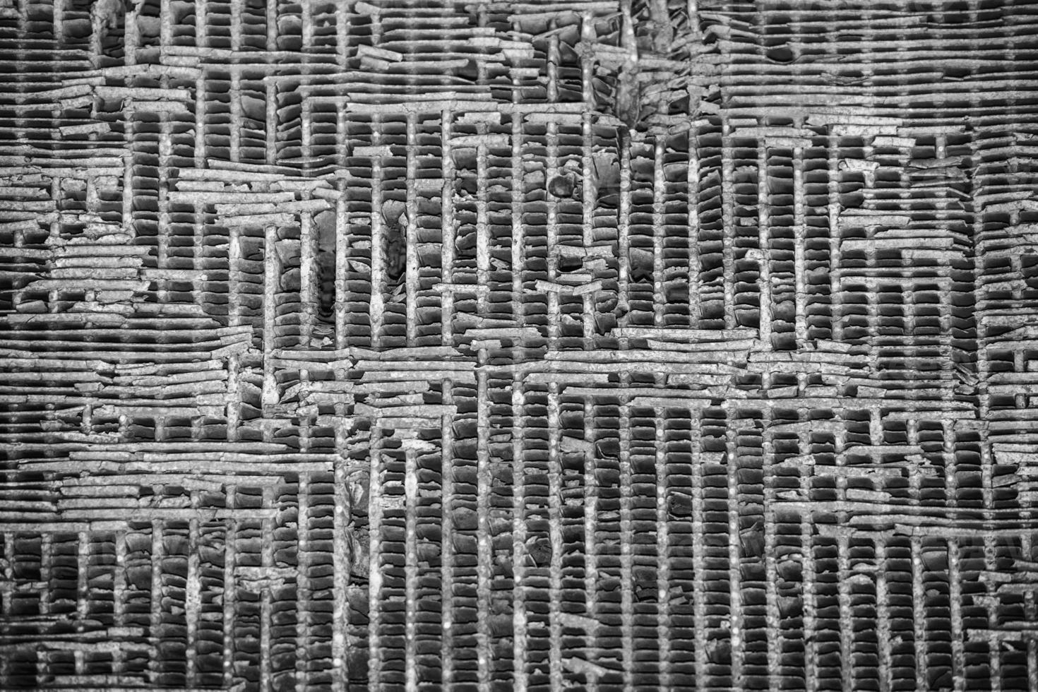 Old rusted antique tractor detail in black and white photo