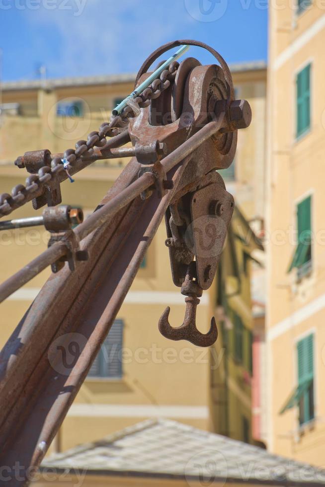 rugged iron old crane in Mediterranean Harbor photo