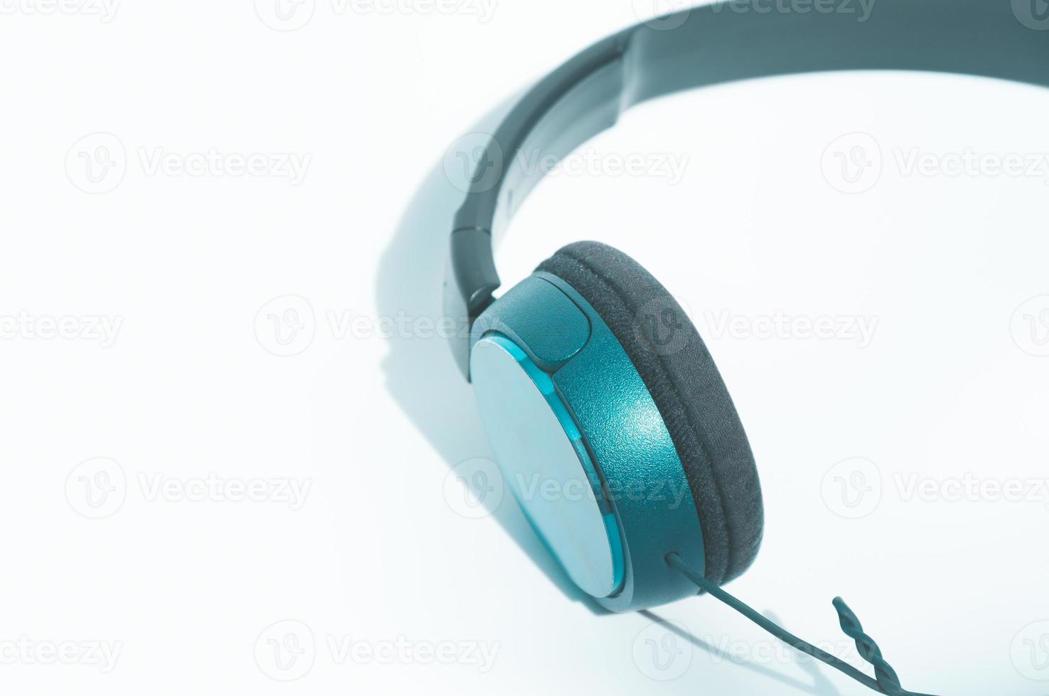 Green headphones on white background photo