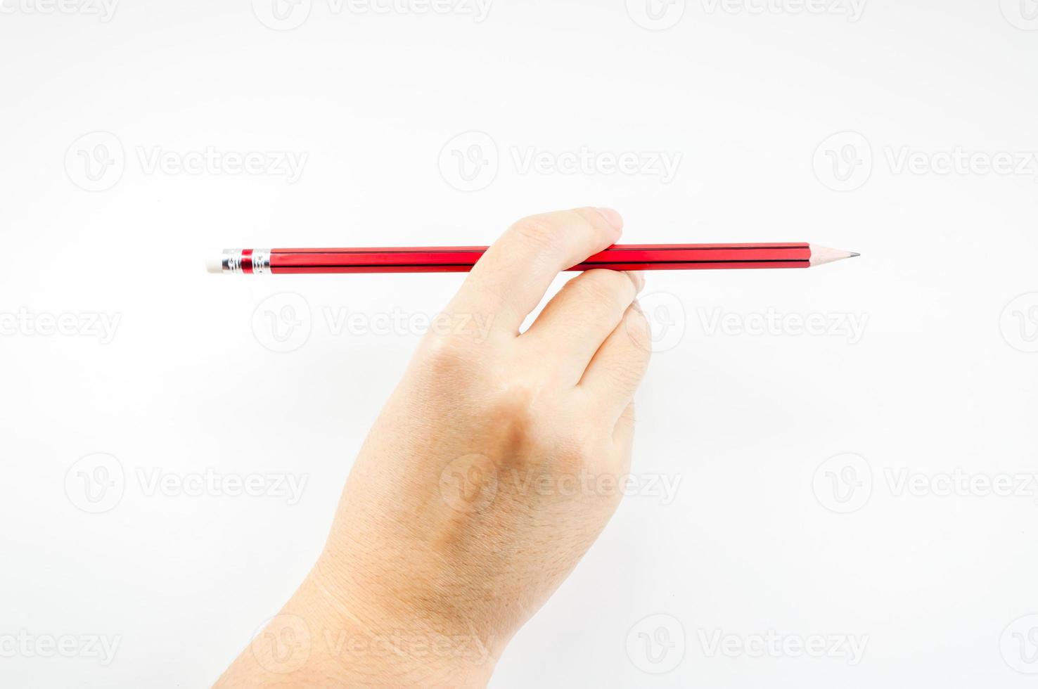 Woman's hand holding with red pencil  on white background photo
