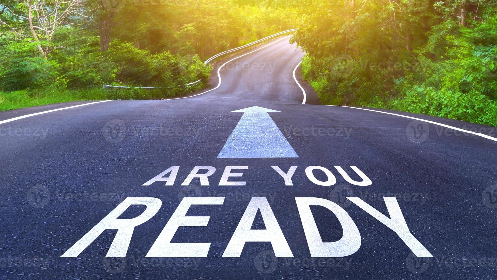 Are you ready written on the middle of the asphalt curve road. Are you ready Write on the road in the middle of the empty asphalt road photo