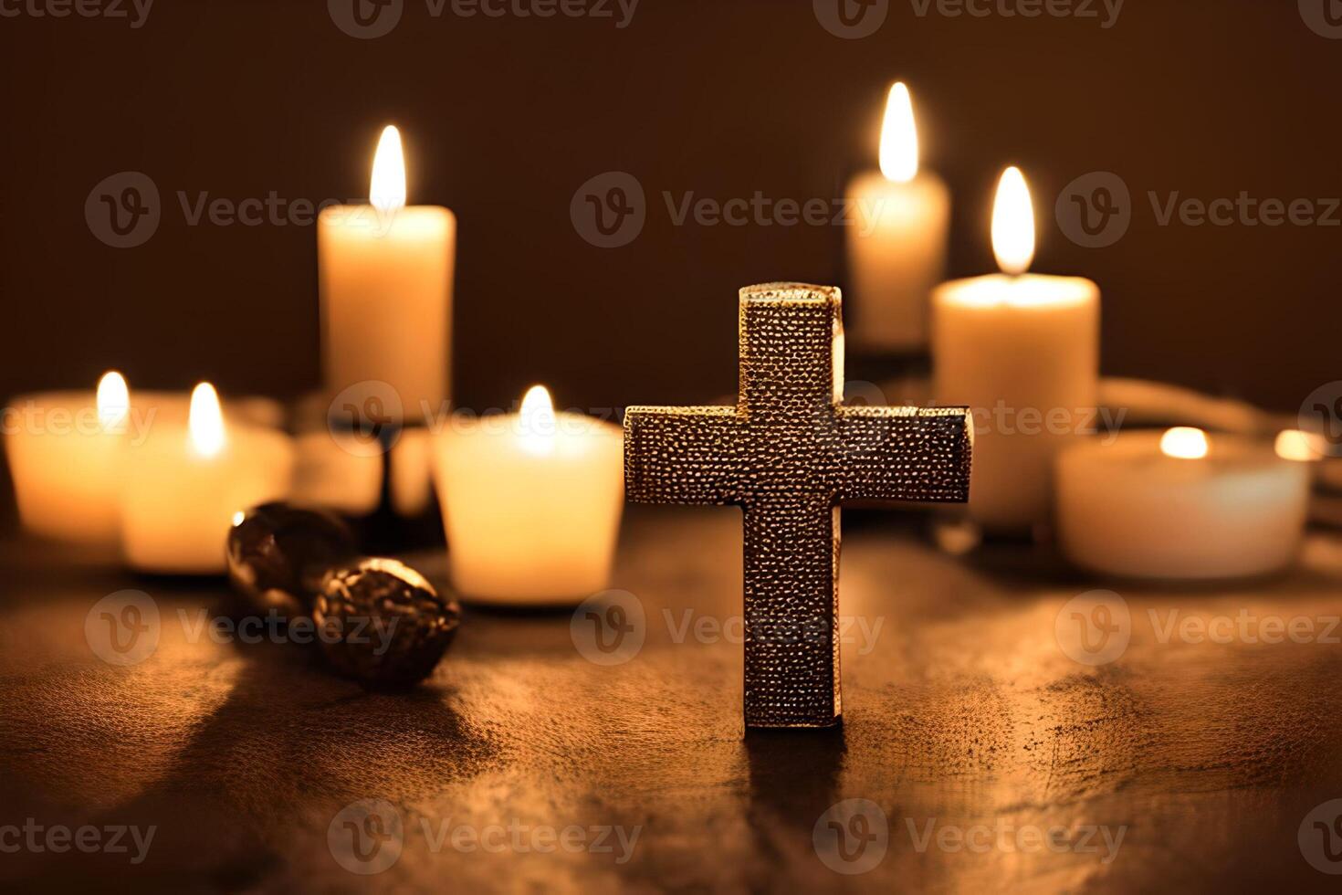 A cross and some candle light at the background for religious theme photo. photo