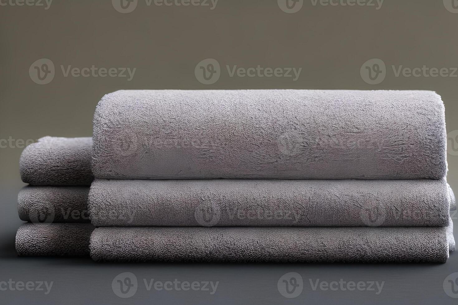 Clean soft blue and green color folded towel nice and tidy stack each other for fitness, bath, swimming, massage and spa marketing background and design material isolated on grey background. photo