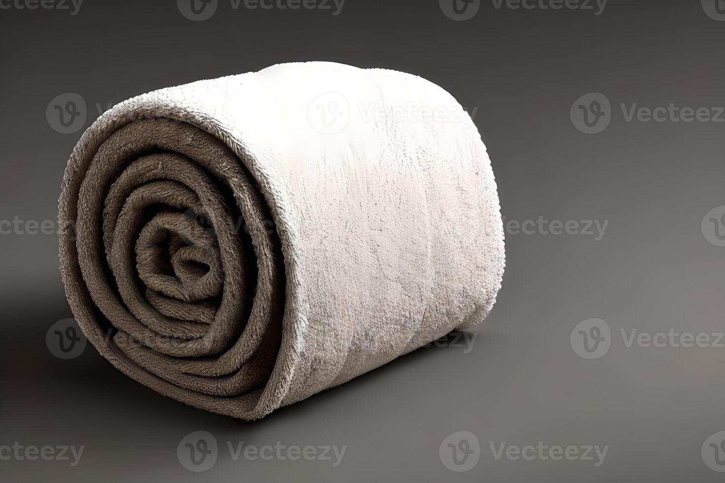 Clean bright grey color roll towel nice and tidy for fitness, bath, swimming, massage and spa marketing background and design material isolated on grey. photo