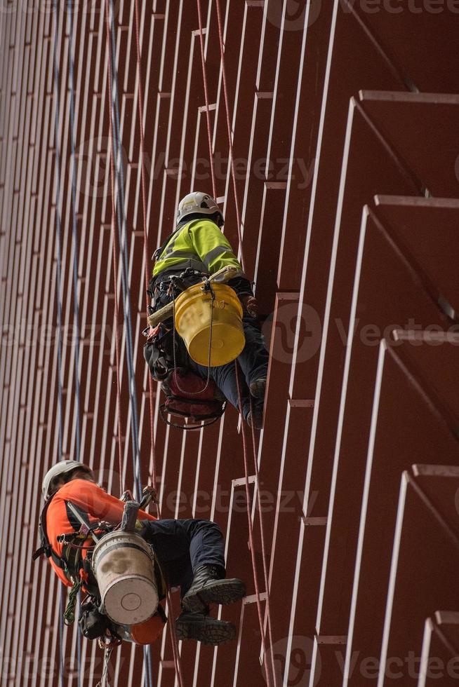 window cleaner climber on skyscraper photo