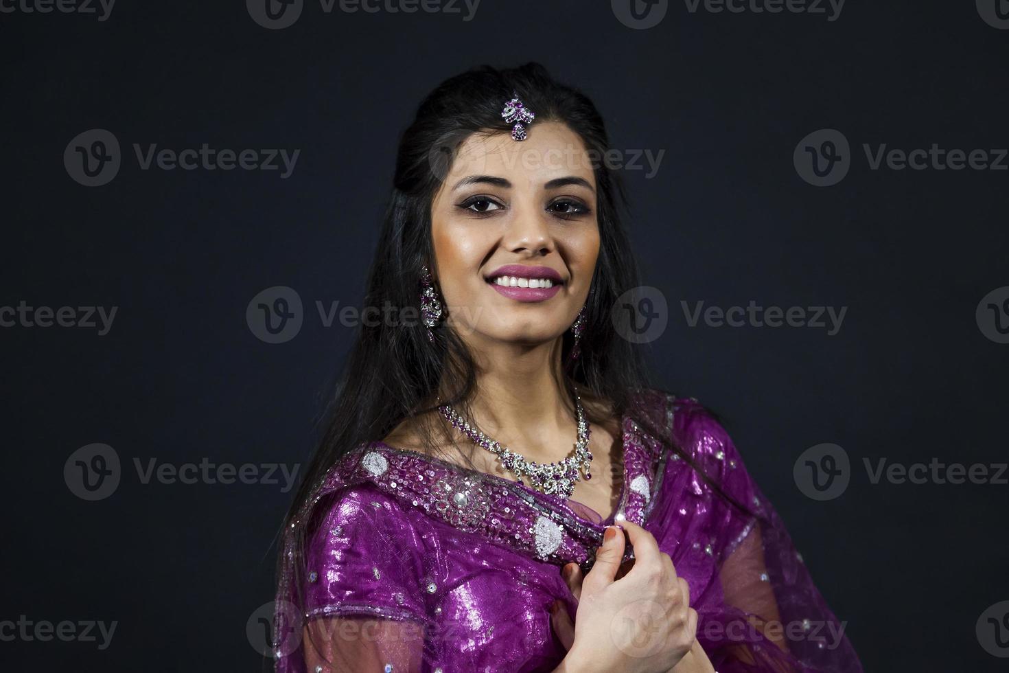 Portrait of smiling beautiful indian girl photo