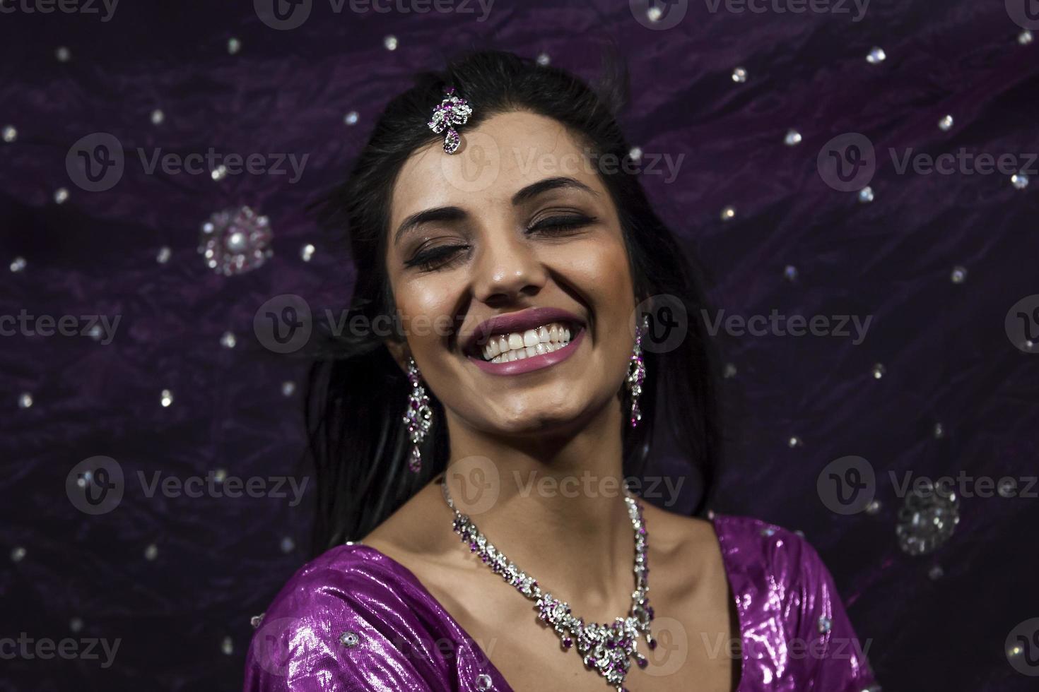 Portrait of smiling beautiful indian girl photo