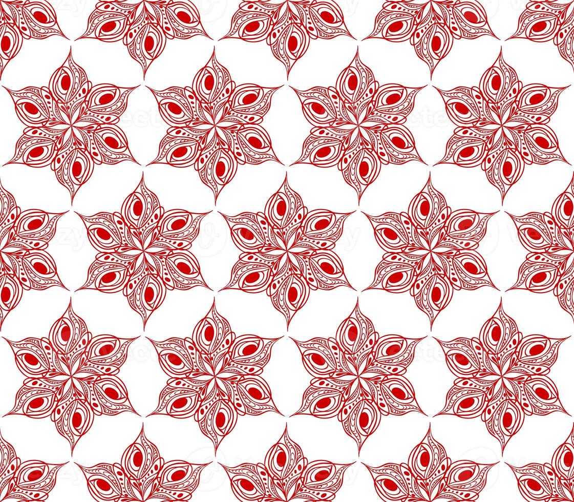 seamless symmetrical pattern of abstract red graphic elements on a white background, texture, design photo