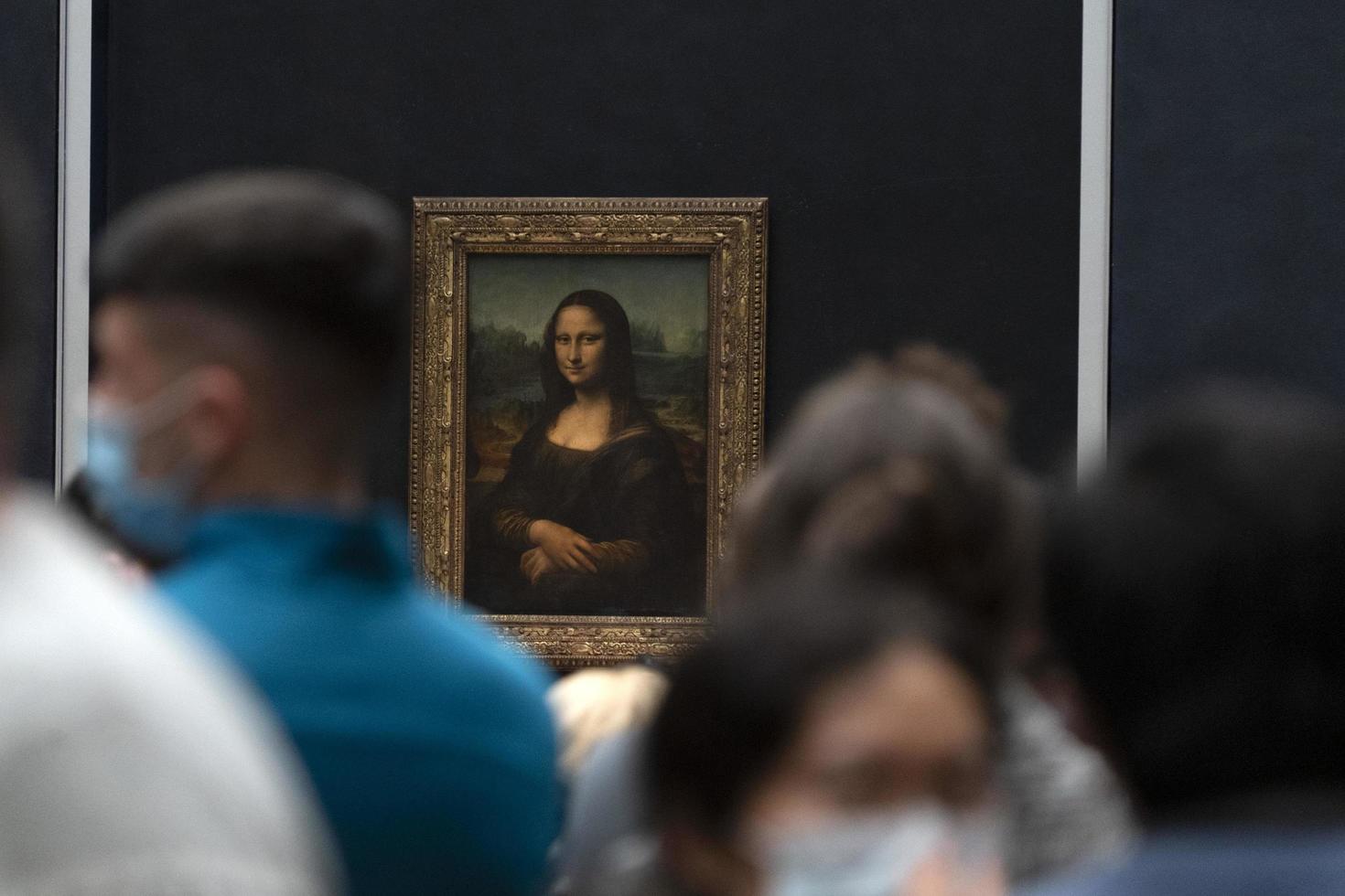 PARIS, FRANCE - NOVEMBER 18 2021 - Mona Lisa room is crowded of people photo