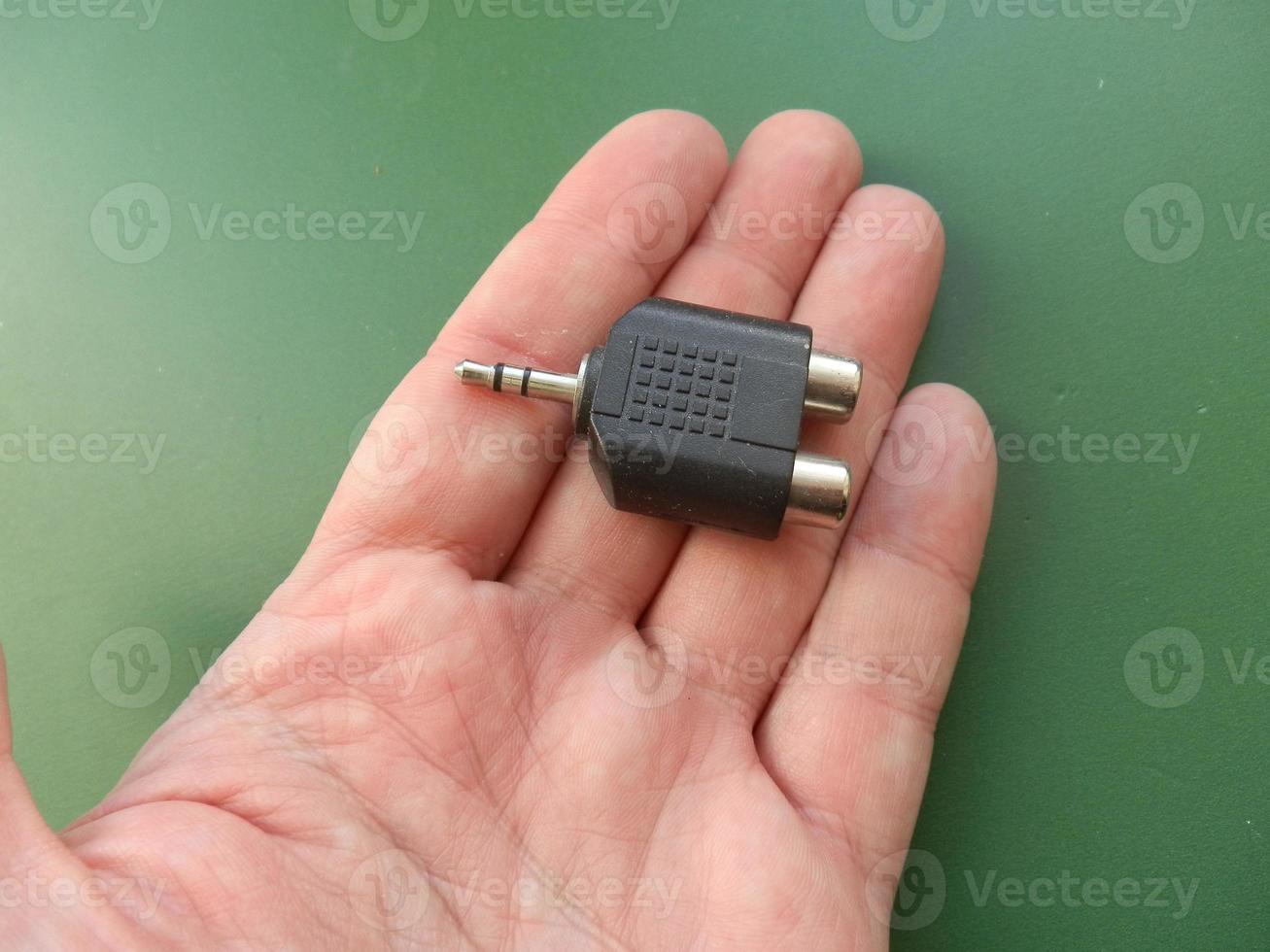 Accessory for smartphone and computer in hand photo