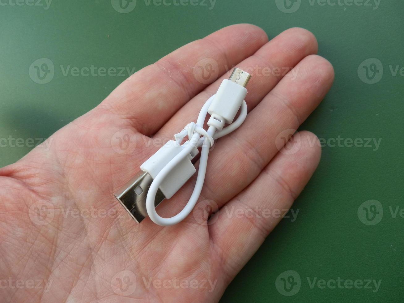 Accessory for smartphone and computer in hand photo