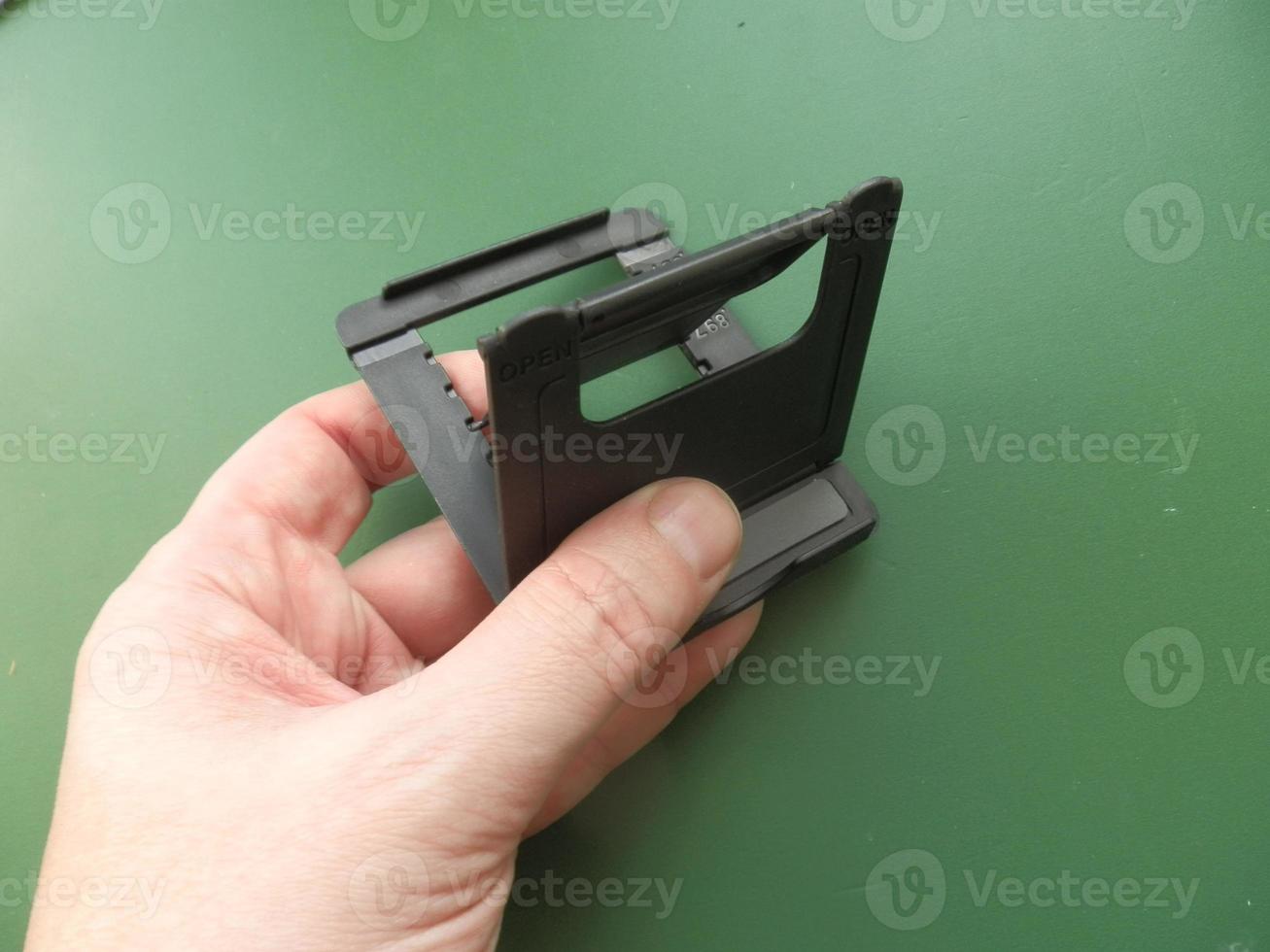 Accessory for smartphone and computer in hand photo