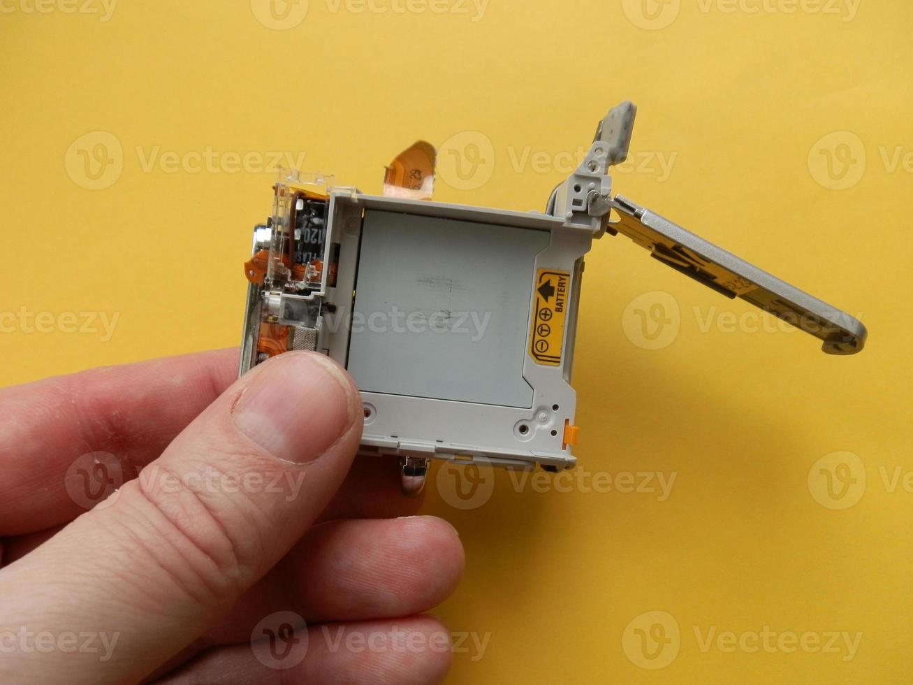 Repair and disassembly of a pocket digital camera photo