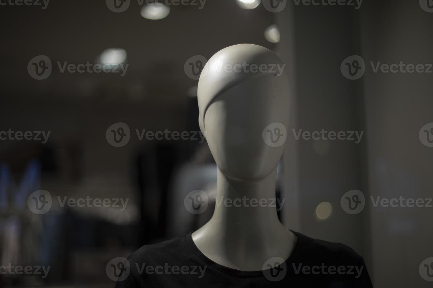 White mannequin. Clothing store. Showcase details. photo