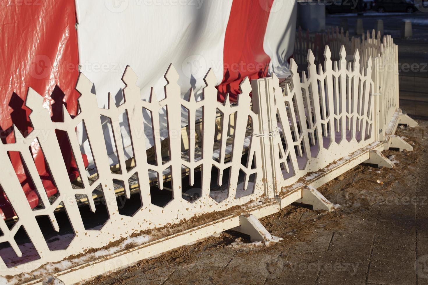 White fence. Small fence made of wood at fair. photo