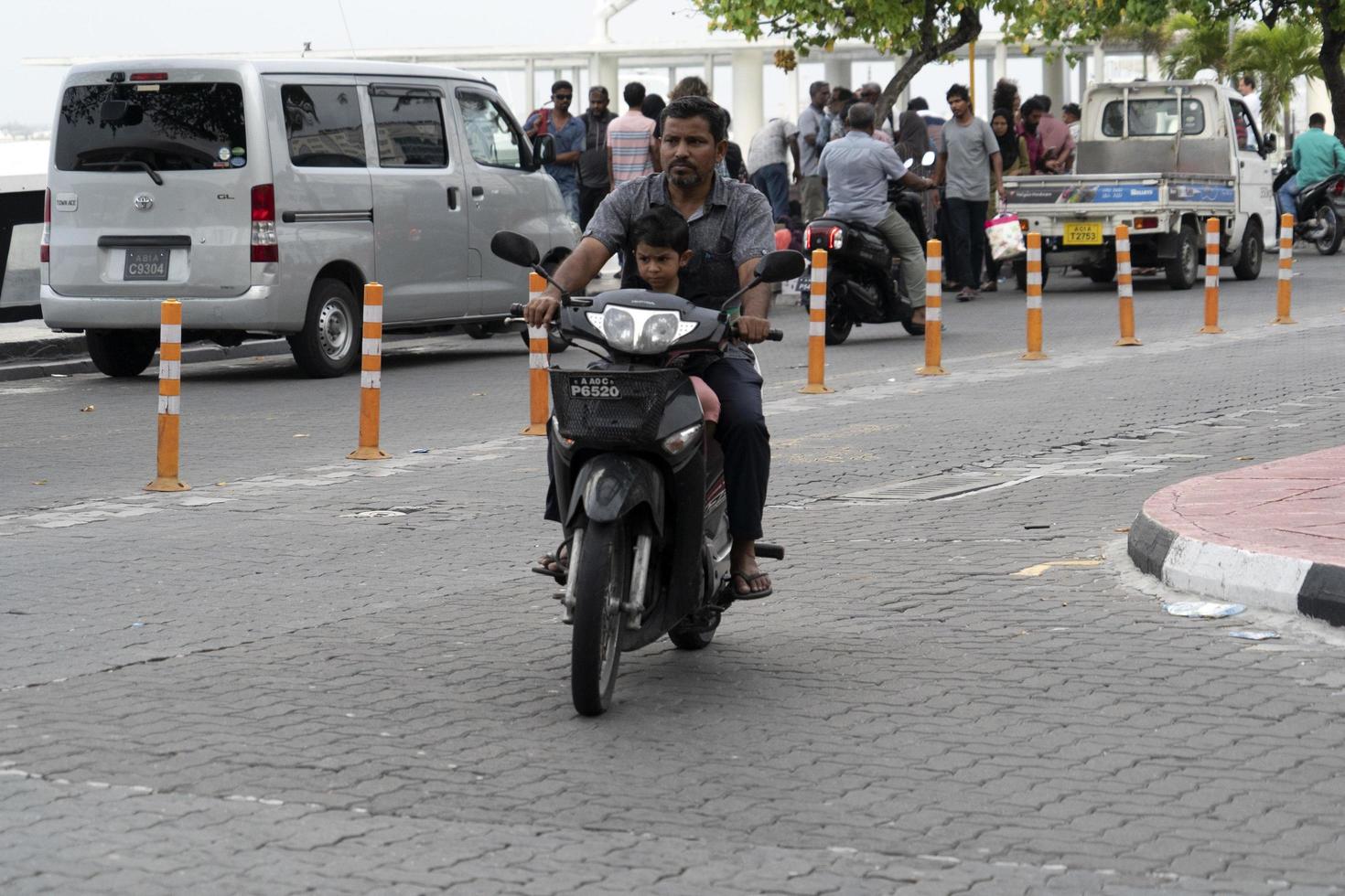 MALE, MALDIVES - FEBRUARY 16 2019 - Traffic in the street before evening pray time photo