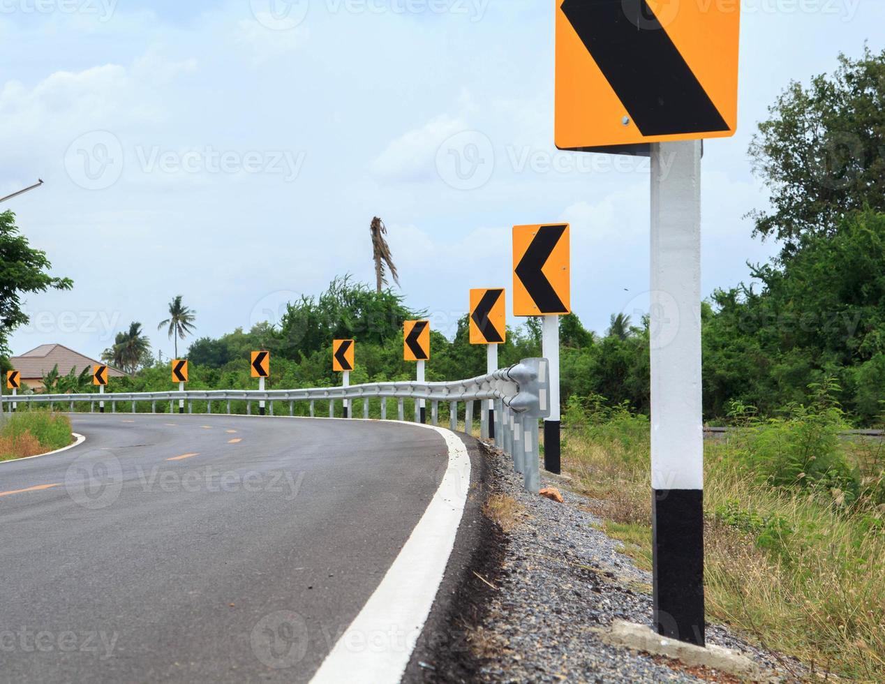 Traffic signs Be careful of roads and curves. Drive slowly and be careful of the curves ahead on rural highways and beautiful blue skies. photo