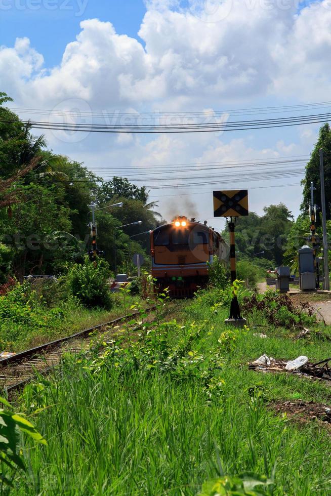 Trains are leaving the station to transport people to different stations with diesel locomotives. It is a safe and time-saving journey according to people's lifestyles for traveling and on vacation. photo