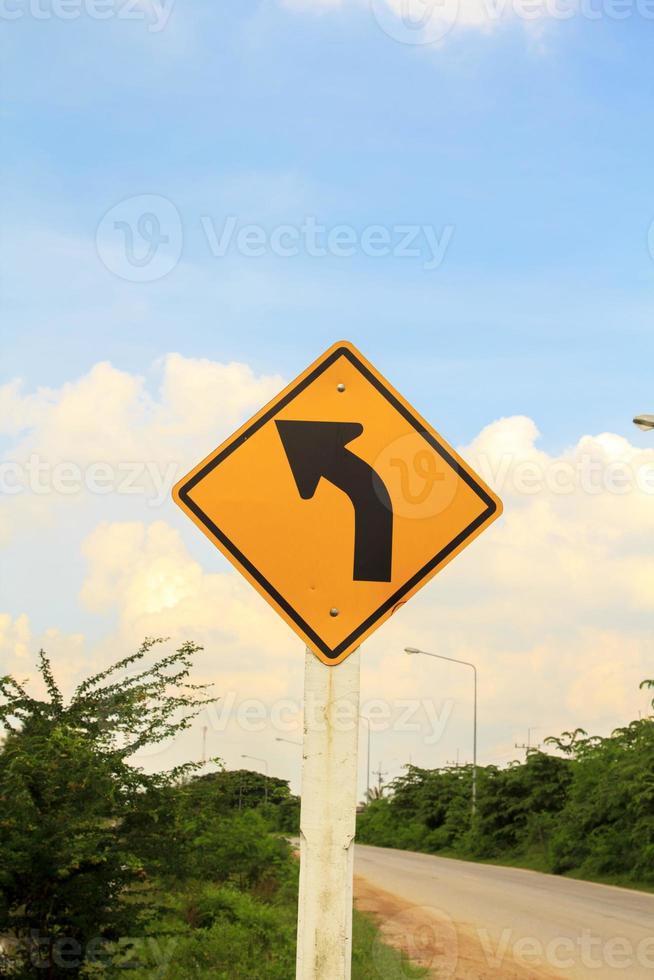 Road Signs Watch out for roads and bends. Drive slowly and watch out for the bends ahead on rural highways and beautiful blue skies on a sunny, sunny day. photo