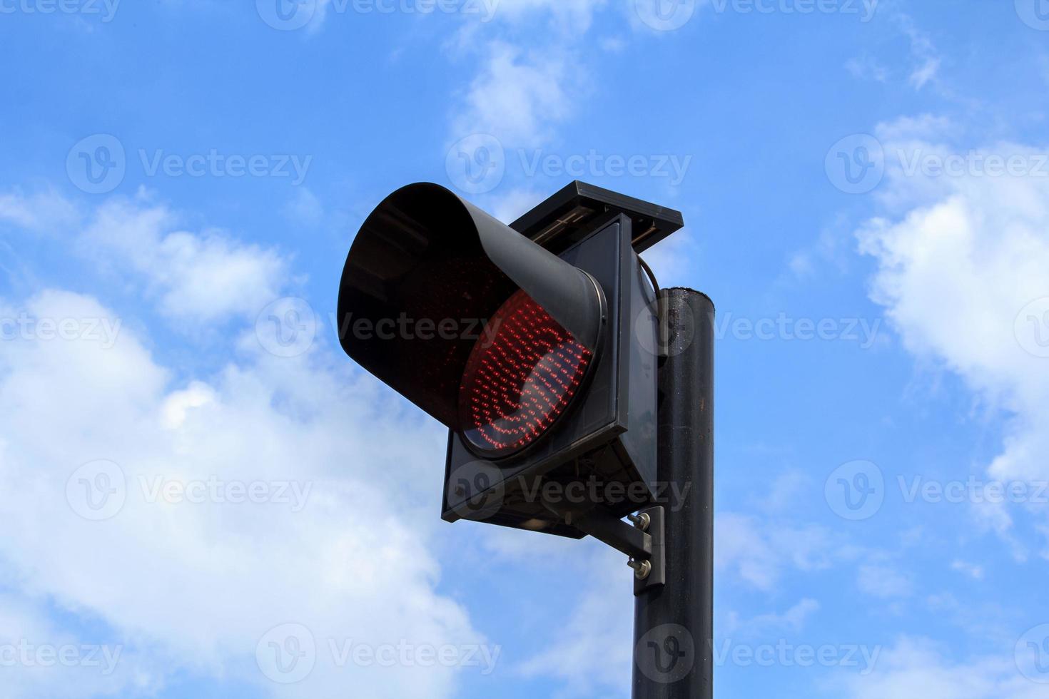 Flashing lights installed at junctions to reduce accidents for drivers to be careful before reaching the junction. The lighting system is used for clean energy. Installed solar panels on top. photo