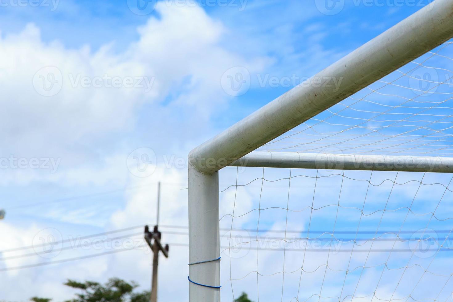 Football gates and soccer fields in the countryside with beautiful blue skies on a sunny and hot afternoon and empty. photo