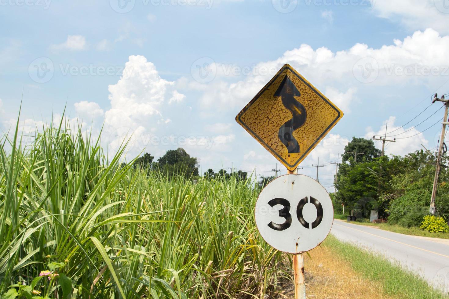 Traffic signs Be careful of roads and curves. Drive slowly and be careful of the curves ahead on rural highways and beautiful blue skies. photo
