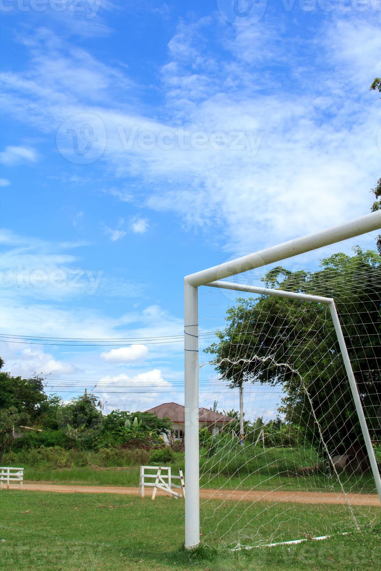 Football gates and soccer fields in the countryside with beautiful blue