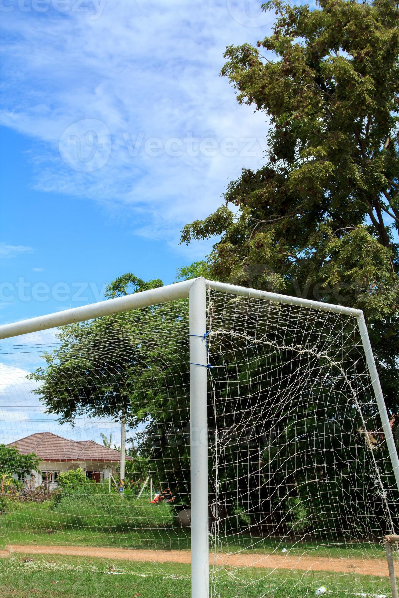 Football gates and soccer fields in the countryside with beautiful blue