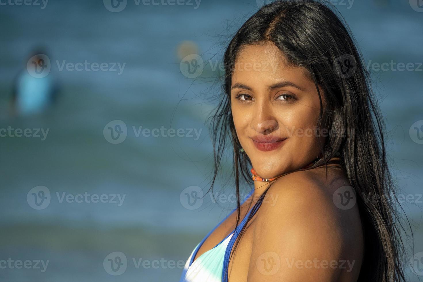 beautiful black hair girl mexican latina portrait on baja california beach photo