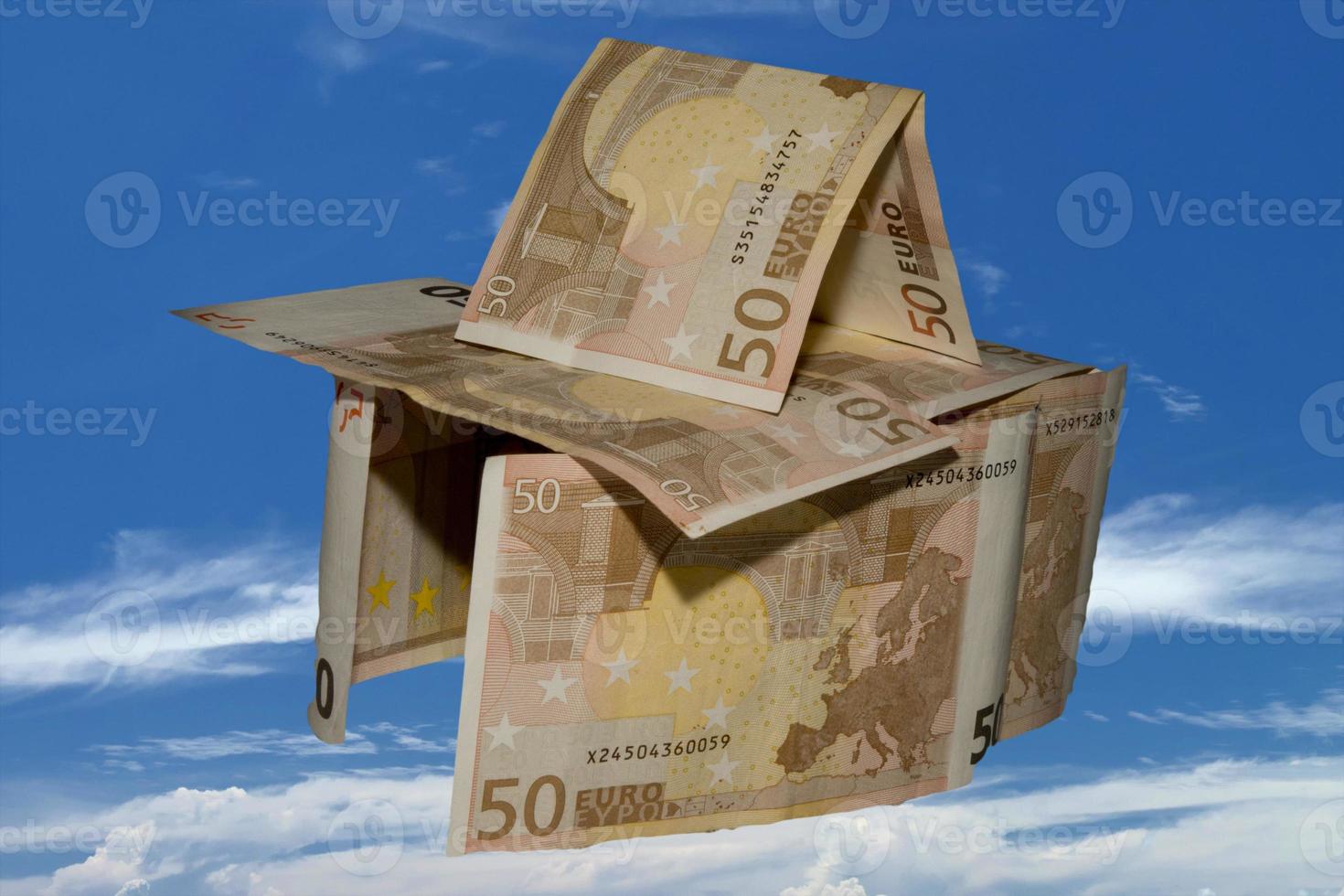 Euro paper money castle in the sky background photo