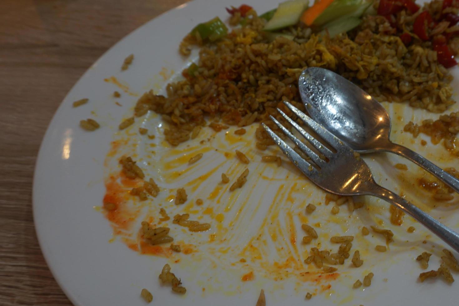 Leftover food on plate photo