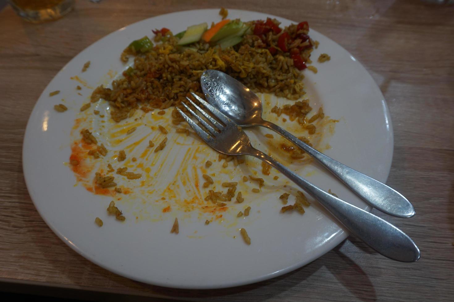 Leftover food on plate photo