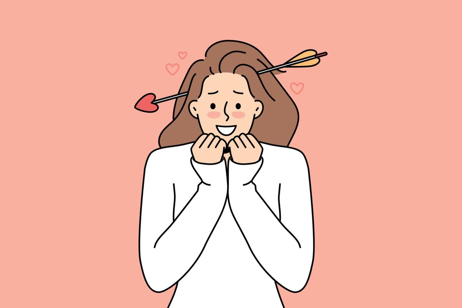 Smiling young woman with cupid arrow in head feel head over heels