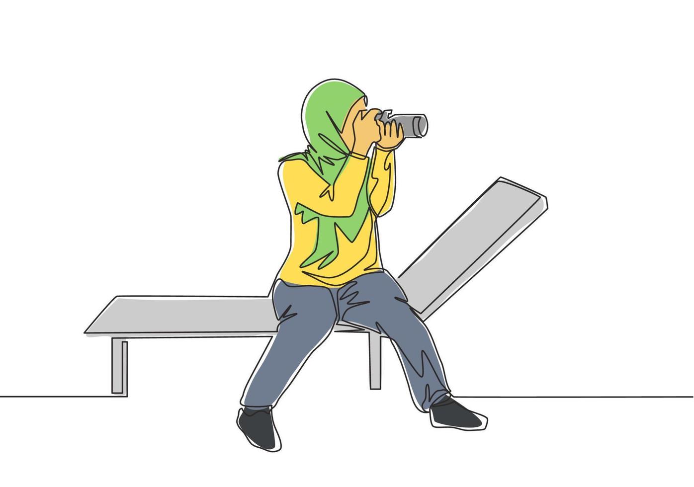 One continuous line drawing of young pretty happy muslimah with veil sitting on chair with camera. Beautiful Asian woman in trendy hijab fashion concept single line draw design vector illustration