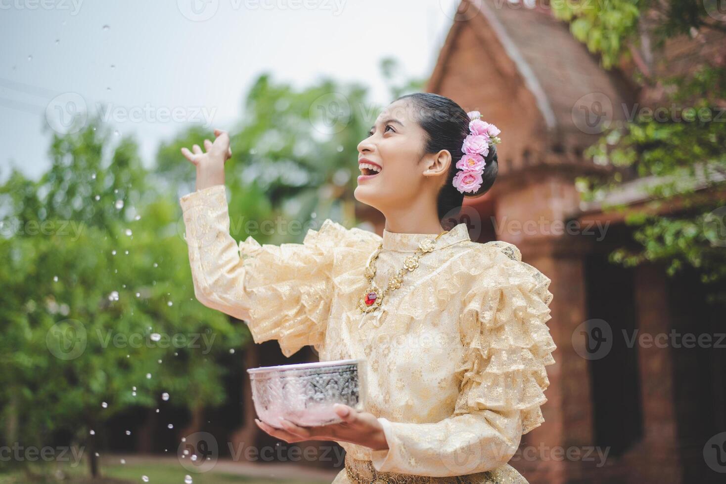 Portrait beautiful woman in Songkran festival with Thai Traditional costume photo