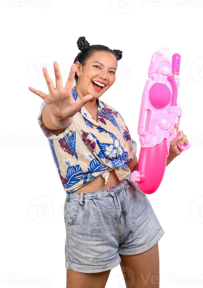 Portrait smiley woman in Songkran festival with water gun photo