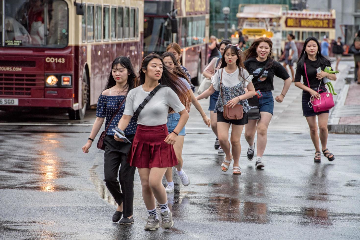 WASHINGTON D.C., USA - JUNE, 21 2016 - Asian girls runnign outside Union Station photo