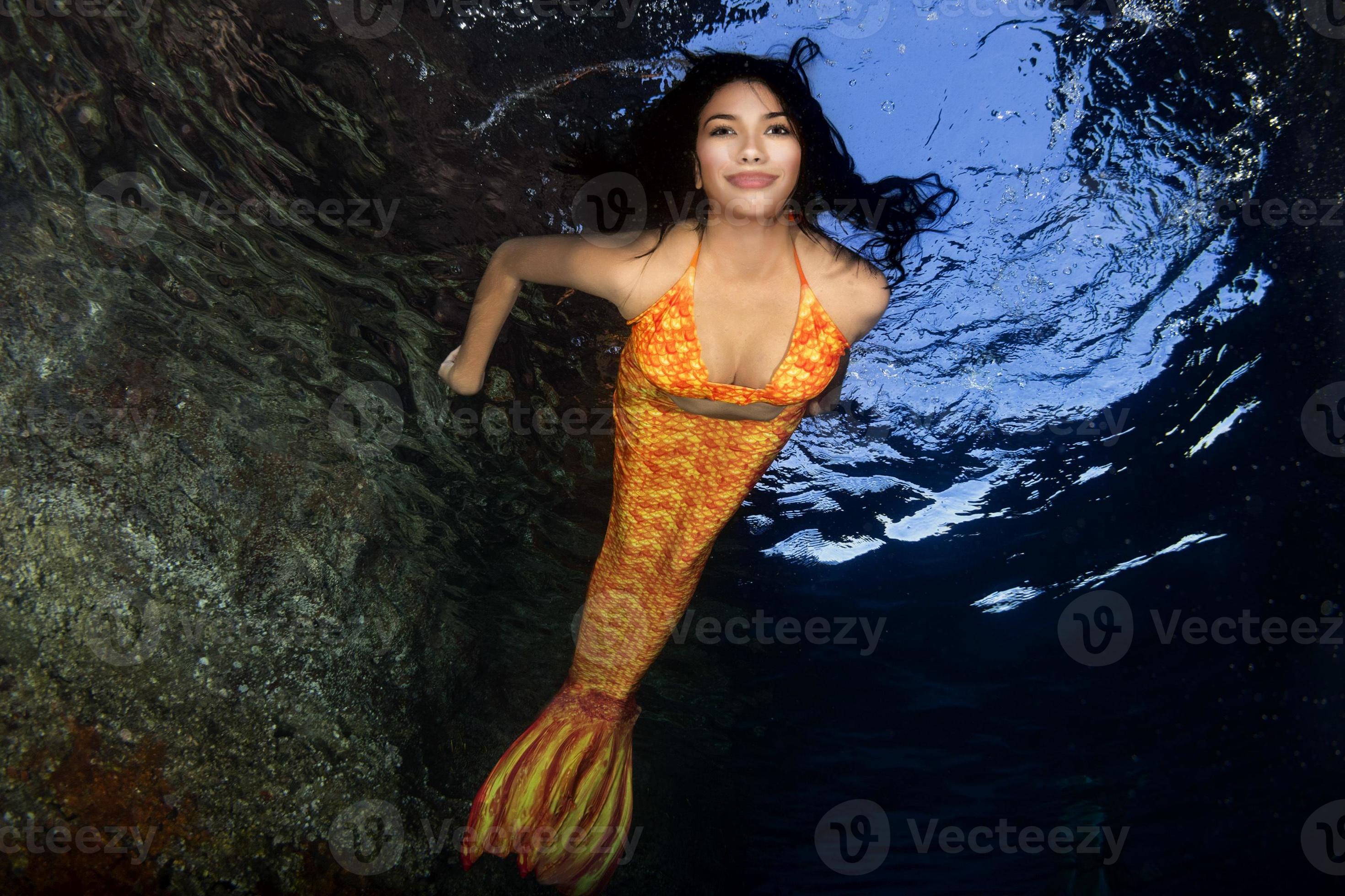 tail Mermaid swimming underwater in the deep blue sea 20384598 Stock Photo at Vecteezy