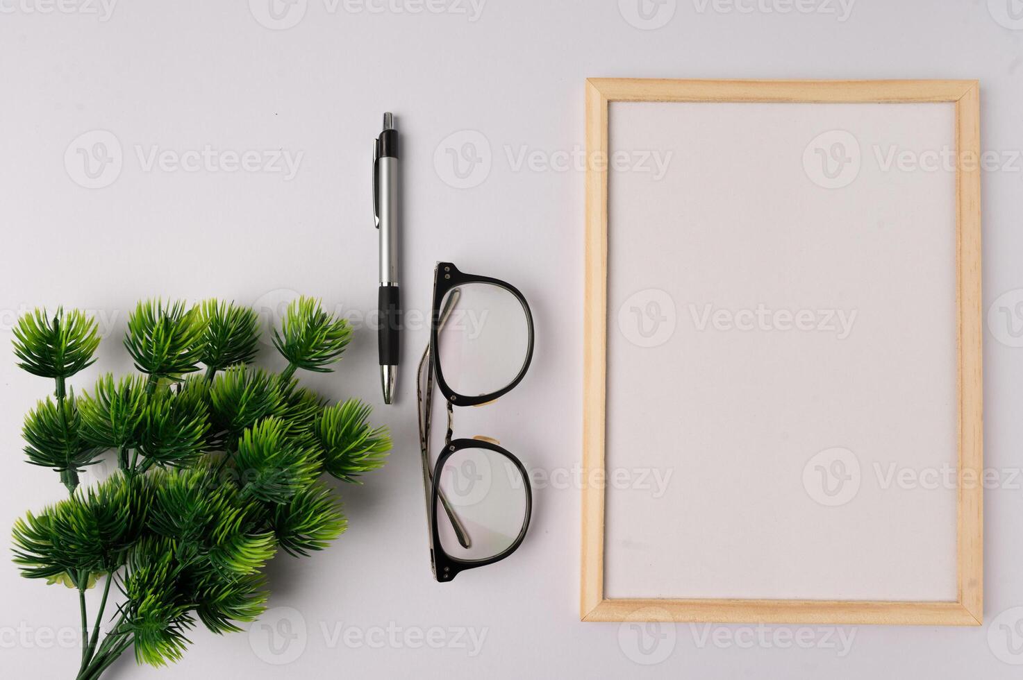 Whiteboard and decorations on white background photo