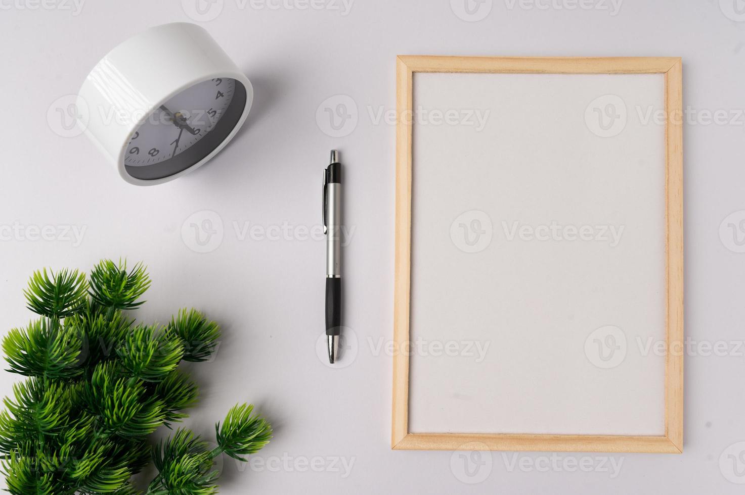 Whiteboard and decorations on white background photo