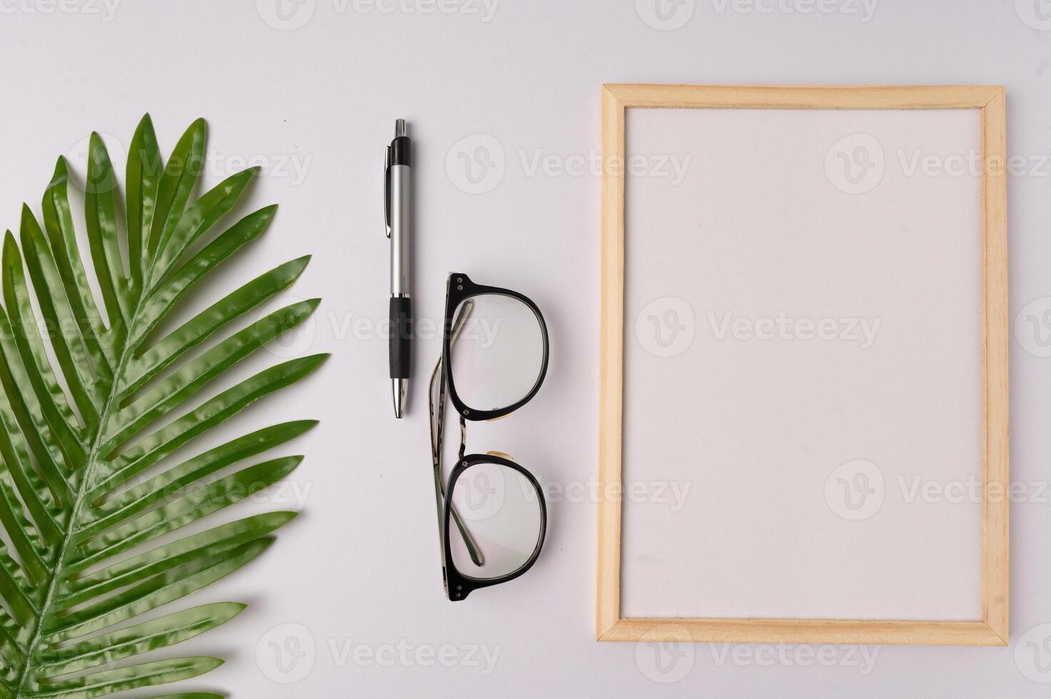 Whiteboard and decorations on white background photo