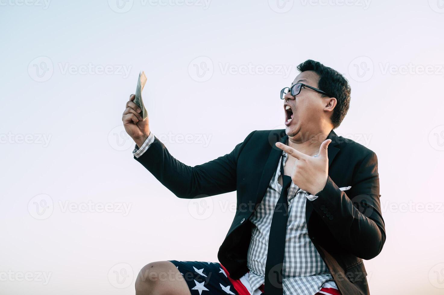 Young businessman man in crazy and funny manner posture photo