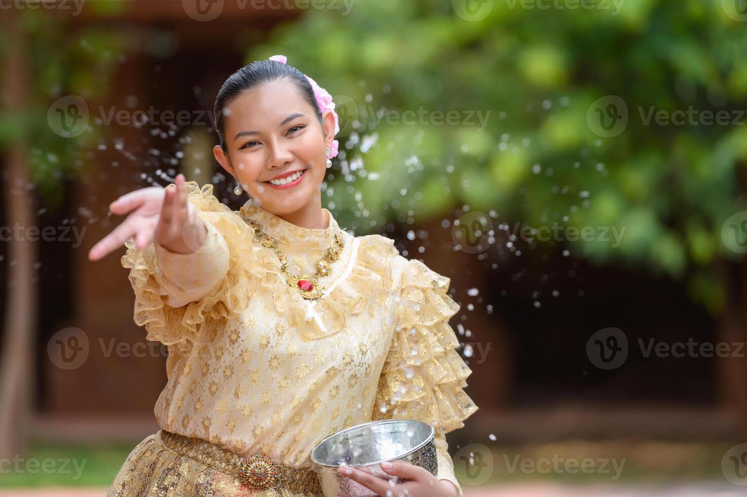 Portrait beautiful woman in Songkran festival with Thai Traditional costume photo