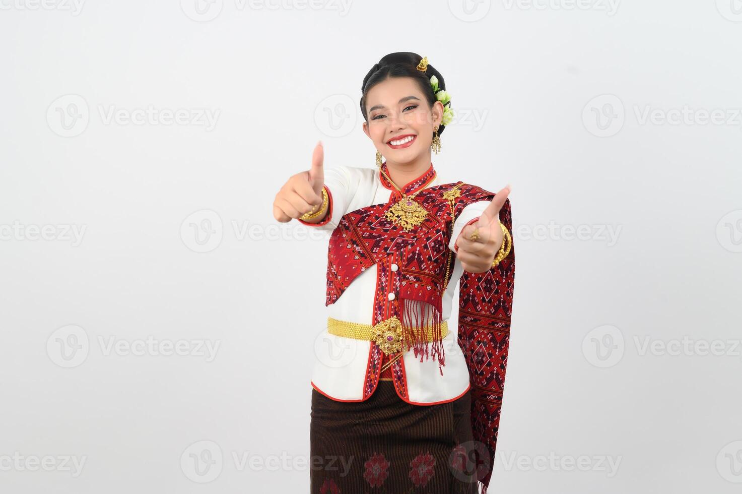 Young beautiful woman in Thai lanna costume with thumb up posture photo