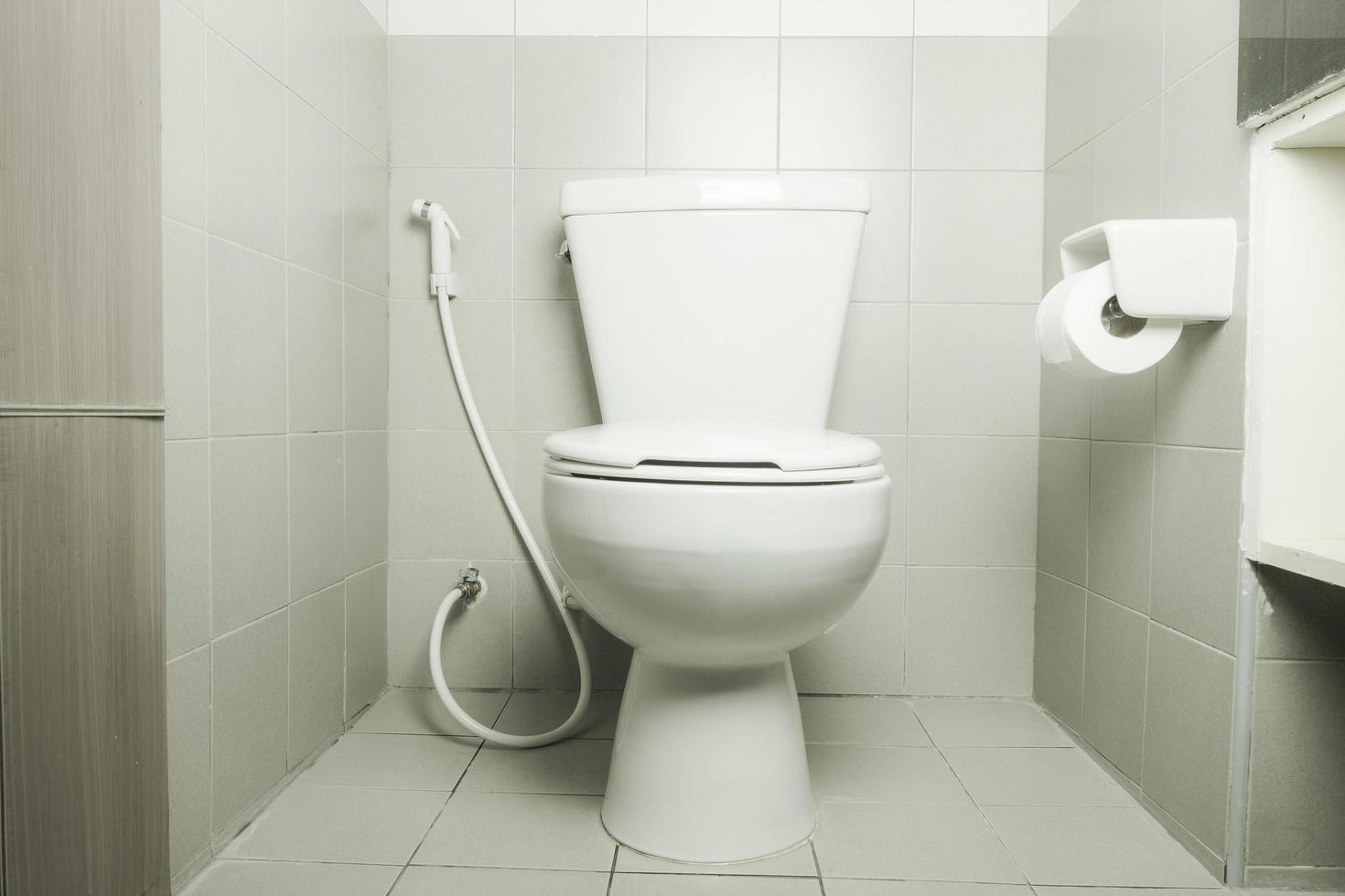 white ceramic toilet bowl in bathroom photo