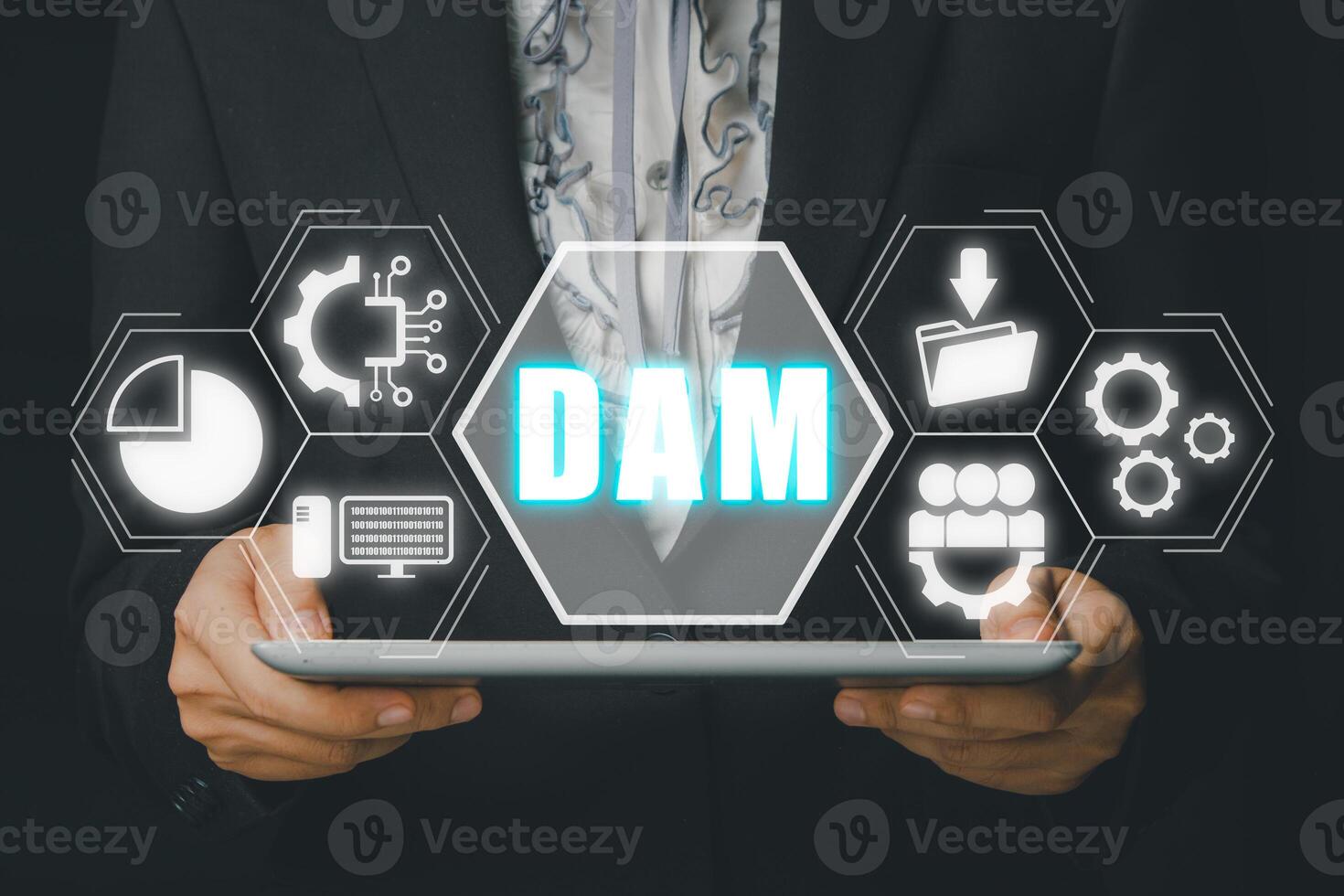 DAM, Digital Asset Management Organization Concept, Person hand using digital tablet with Digital Asset Management icon on virtual screen. photo