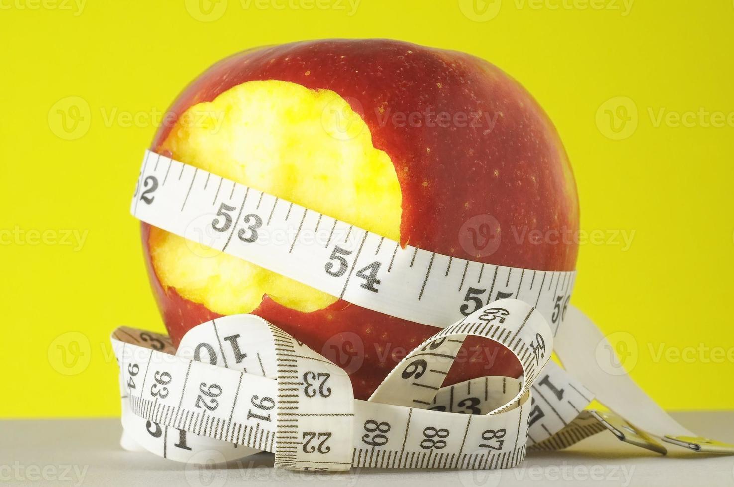 Apple with metric tape photo