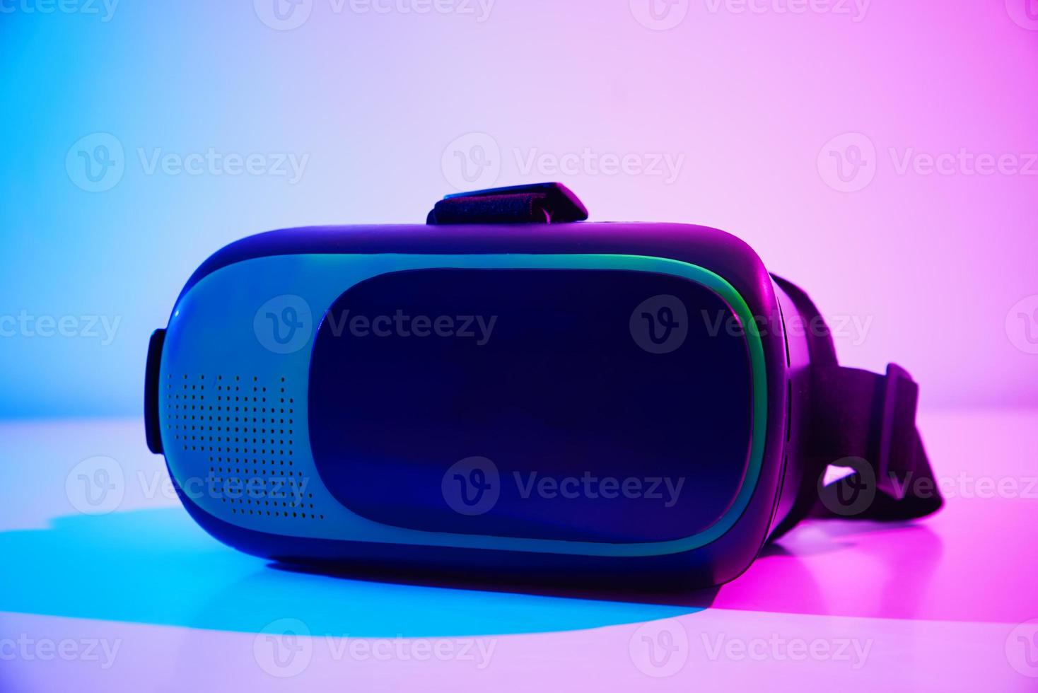 Virtual reality glasses on colorful background. Future technology, VR concept photo