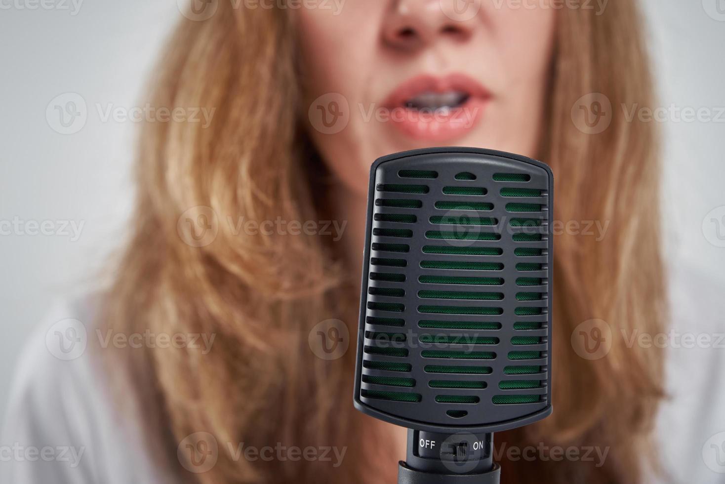 Woman records online podcast at home, podcasting concept photo