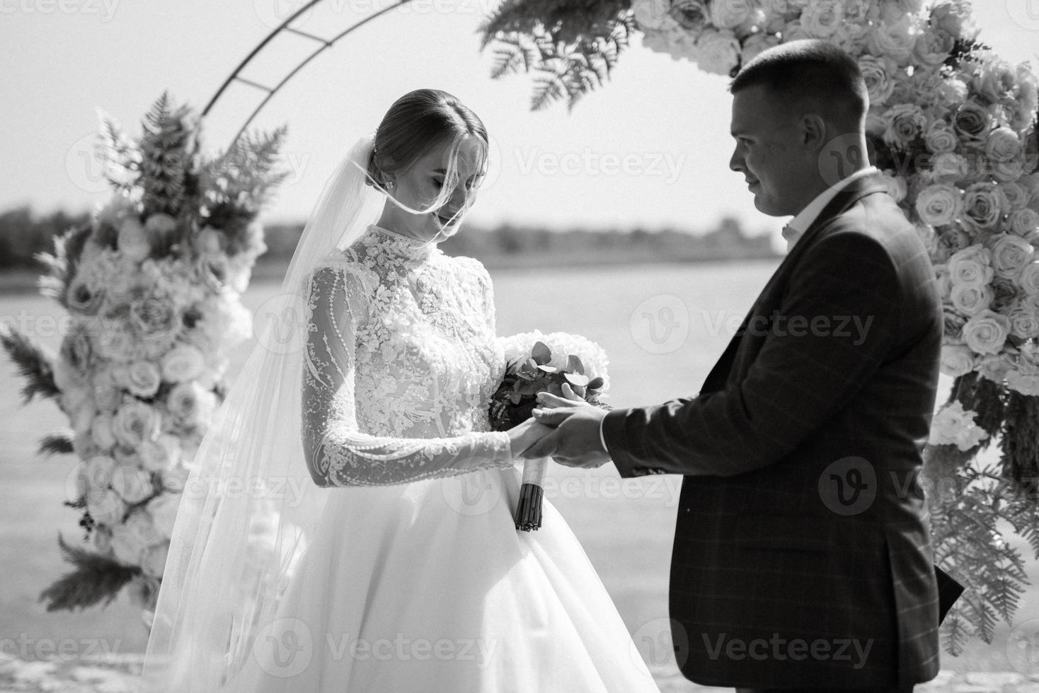 wedding ceremony of the newlyweds on the pier photo